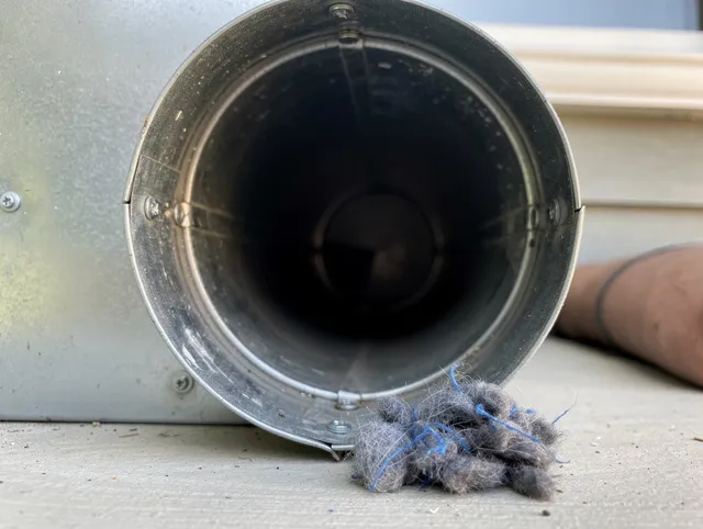 Savannah Dryer Vent Cleaning technician using specialized equipment to clear severe dryer vent blockage in Savannah